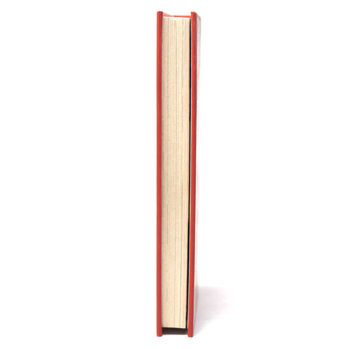 Book with red spine on a white background