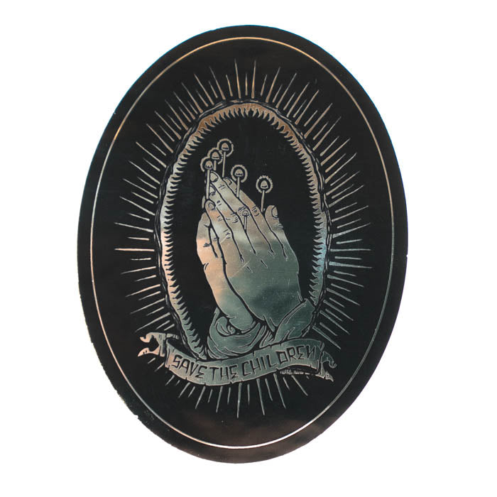 Circular sticker with praying hands and text 'Save the Children' on a black background