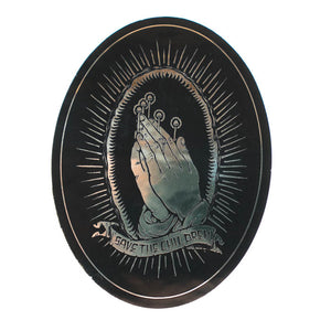 Circular sticker with praying hands and text 'Save the Children' on a black background