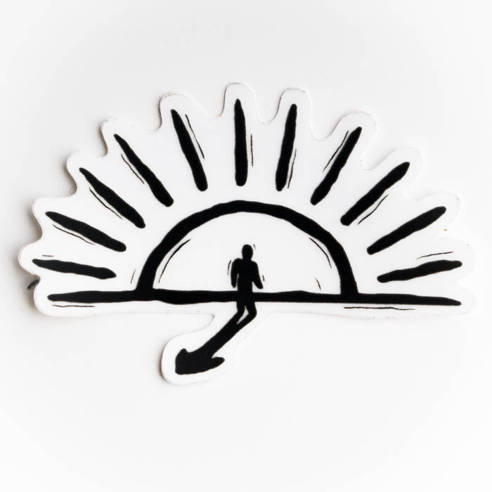 Black silhouette of a person walking under a stylized sun on a white background