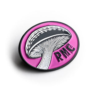 Circular pink badge with a white mushroom illustration and 'PMC' text on a white background