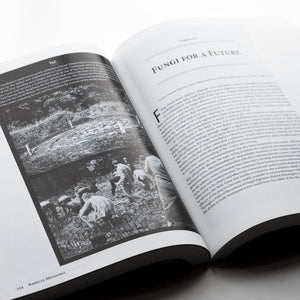 Open book with text and black and white photo on a white background